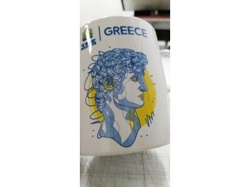 Сублимационная кружка «GREECE» (с лого ITM/TUI) с графикой «Аполлон в синем» и жёлтым контражуром — печать на кружках Уфа — НеоШтамп